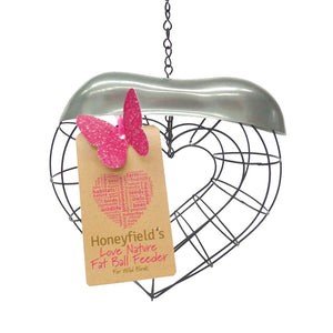 A heart shaped wire cage, with a silver coloured top and a brown label with a pink butterfly.